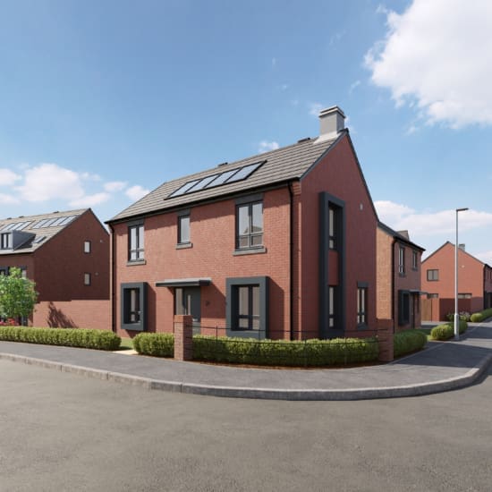 A new build home by Anwyl Homes stands on a corner, featuring red brickwork, large windows, and solar panels on the roof, surrounded by neatly trimmed hedges against a backdrop of blue sky.
