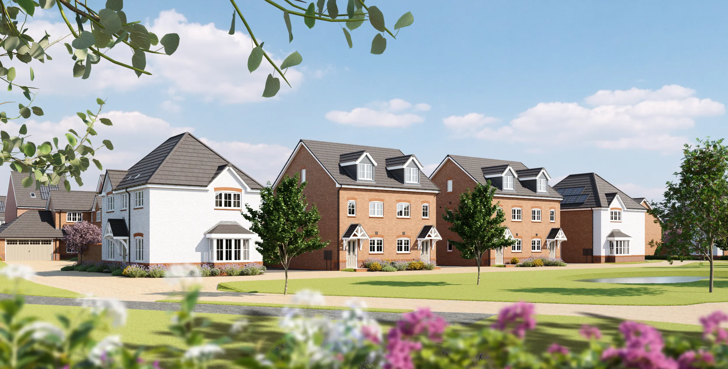 A row of new build homes by Anwyl Homes, featuring a blend of white and red brick designs, manicured lawns, trees, and a clear blue sky in the background.