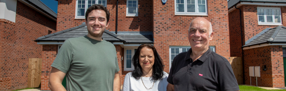 Two sets of happy homeowners outside their homes